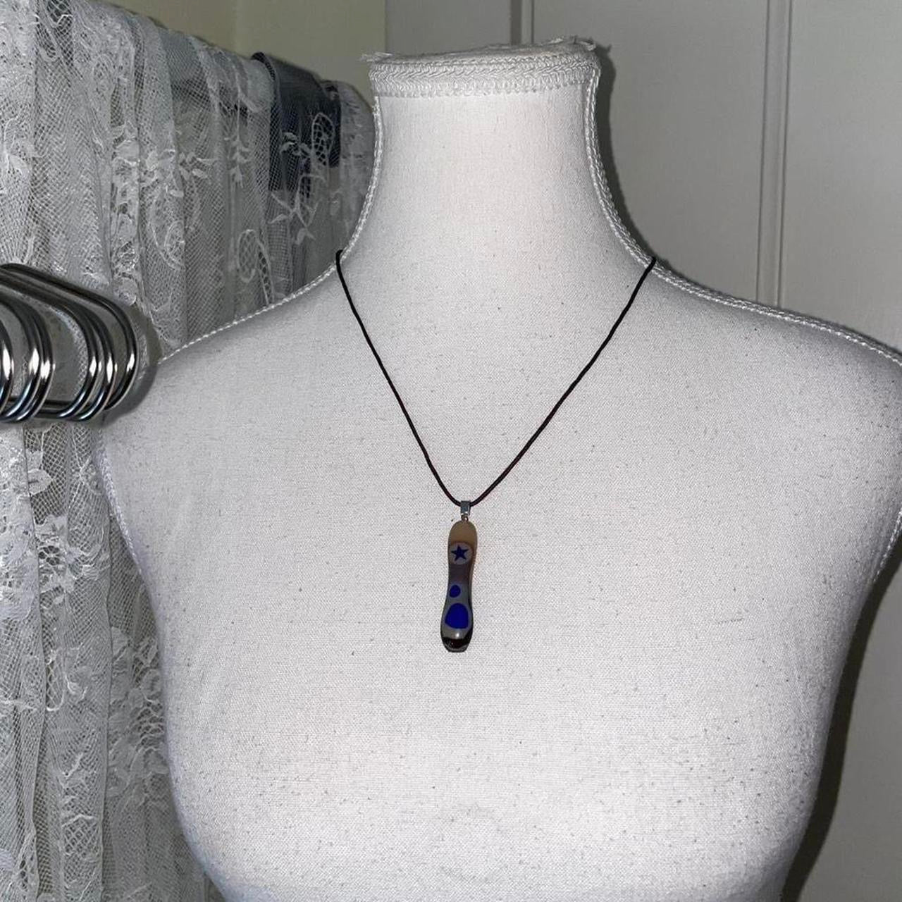 Handmade earth-tone pendant necklace with star detail