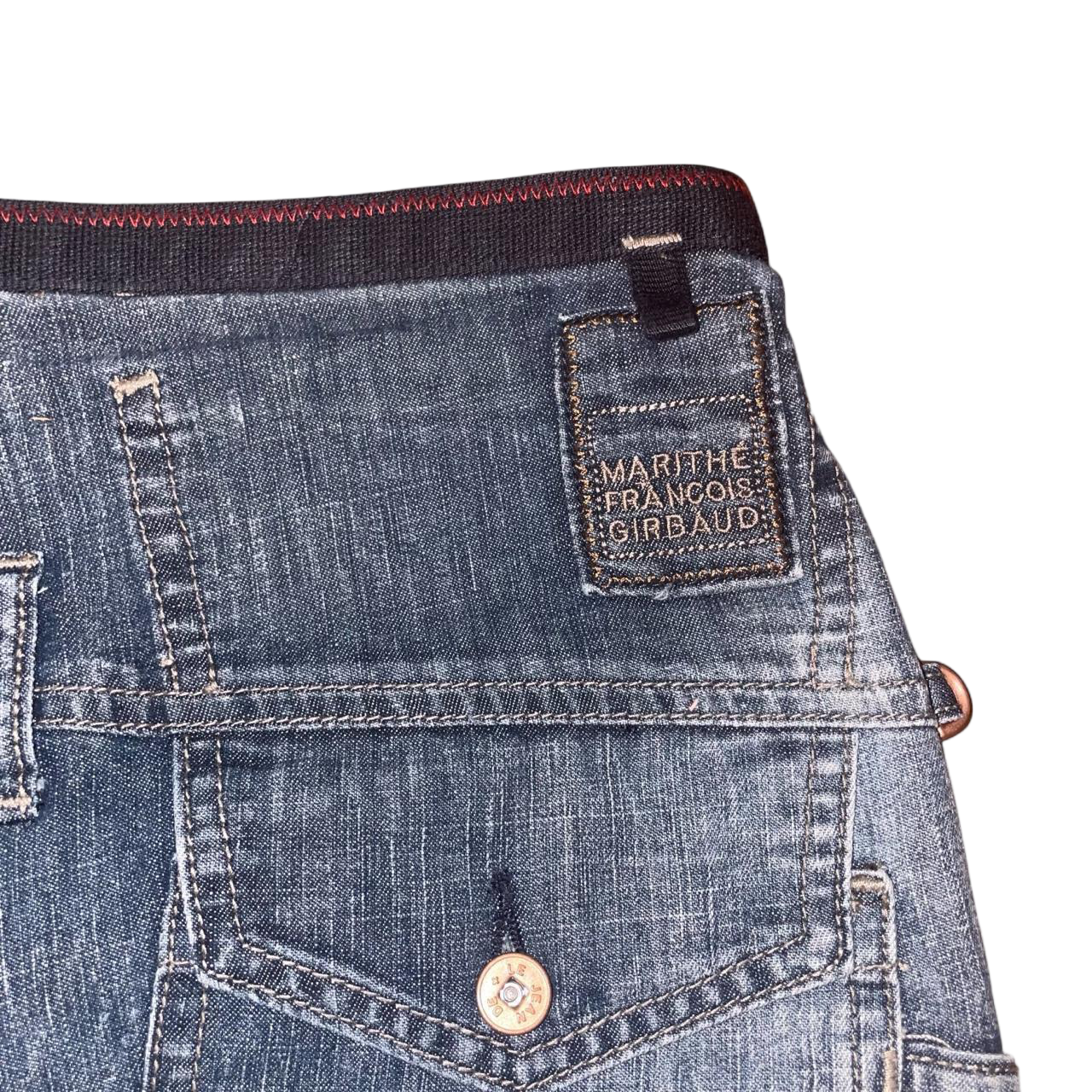 Marithe + Francois Girbaud dark wash denim mini skirt with ruffle detail in back | mid-2000s